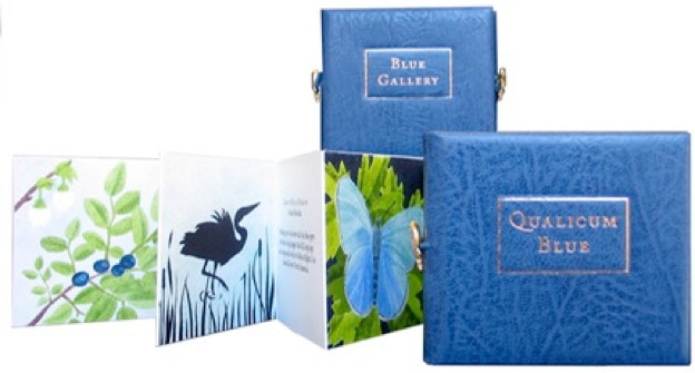 Two books show fron and back covers and stencilled images in Qualicum Blue.
